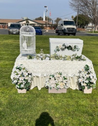 A symbol of love and new beginnings, represented by the white doves in the wedding cage
